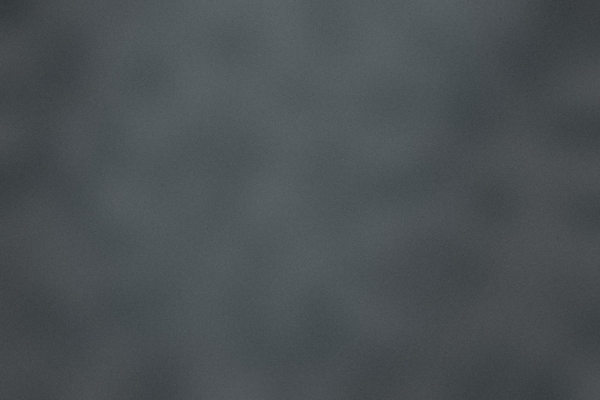 The light, still turning, seen from the sea at night.